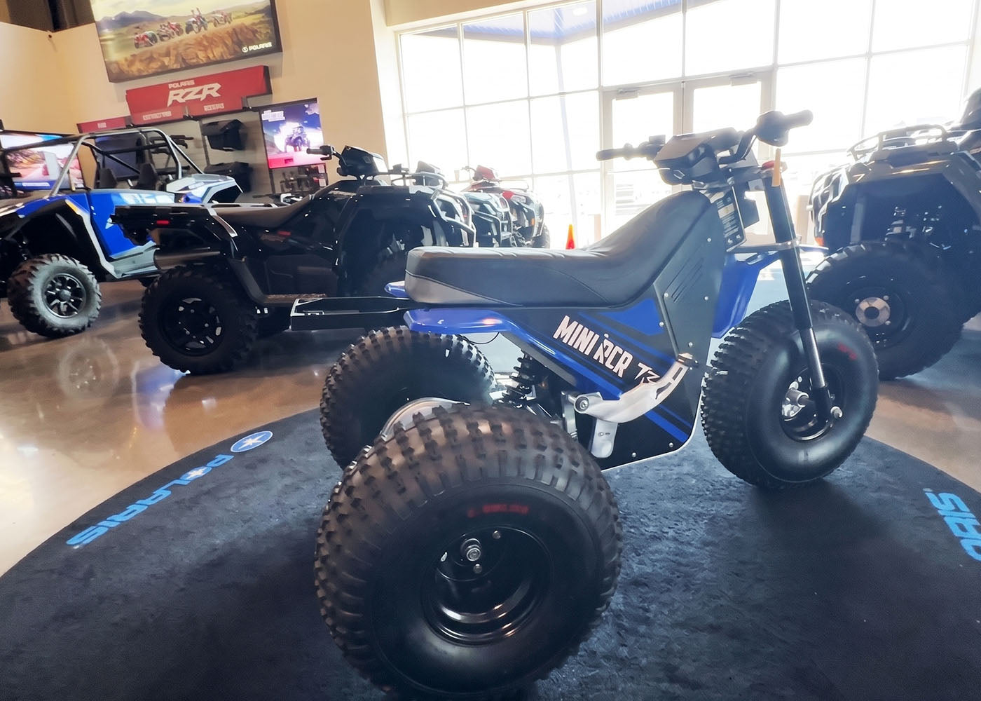 MINI RCR machines in a dealership showroom