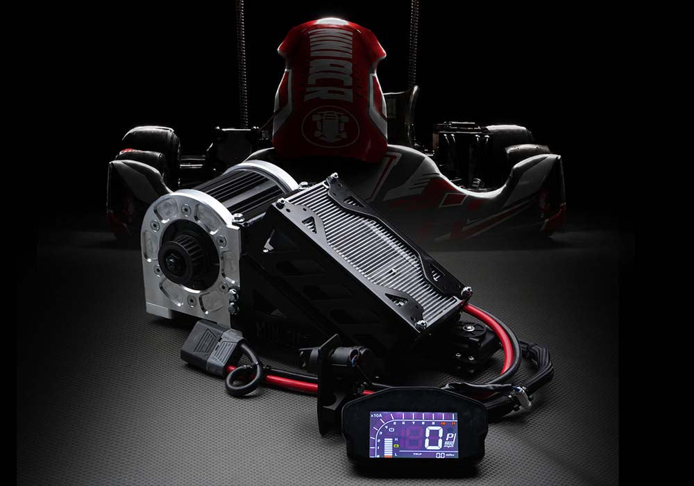 Ghost Volt electric kart conversion kit with motor, controller and display in front of a kart